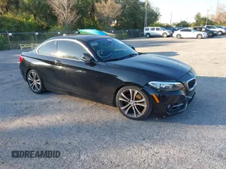 2015 BMW 2 Series 228i with VIN WBA1F5C58FV257021, listed as a IAAI auction lot 41318026 with 154,906 mi miles. Bid and sale history available at carsss.com. Image 1.