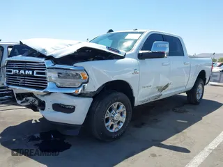 2023 Ram 2500 Laramie with VIN 3C6UR5FL2PG559276, listed as a IAAI auction lot 42281324 with 23,526 mi miles and . Bid and sale history available at DreamBid. Image 2.