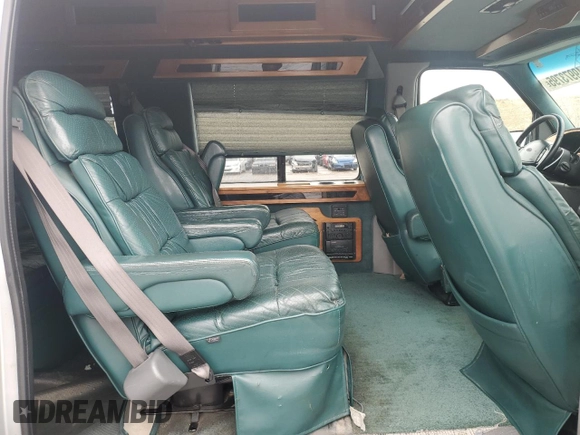 1999 Ford Econoline Cargo Recreational with VIN 1FDRE14L3XHA31771, listed as a Copart auction lot 49973795 with 220,268 mi miles and Salvage title. Bid and sale history available at DreamBid. Image 11.