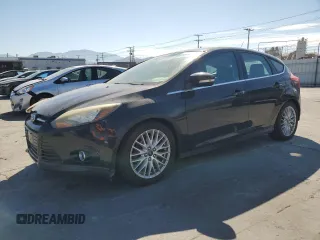 2014 Ford Focus Titanium with VIN 1FADP3N20EL188409, listed as a Copart auction lot 63624975 with 142,292 mi miles and Salvage title. Bid and sale history available at DreamBid. Image 1.