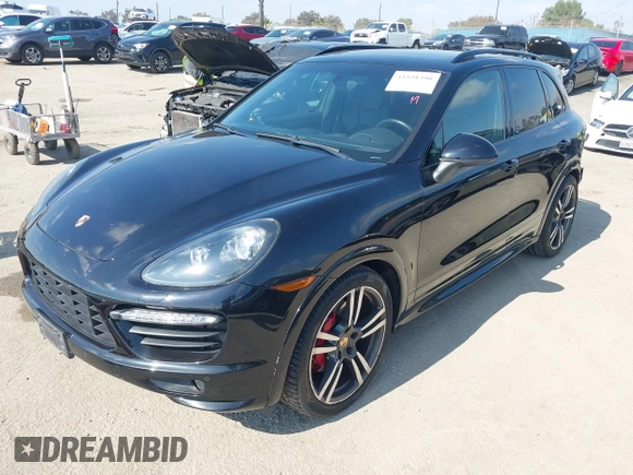 2014 Porsche Cayenne GTS z VIN WP1AD2A24ELA76457, wystawiony jako IAAI lot #41538390 z przebiegiem 101 082 mil mil oraz . Historia ofert i sprzedaży dostępna na DreamBid. Obrazek 22.