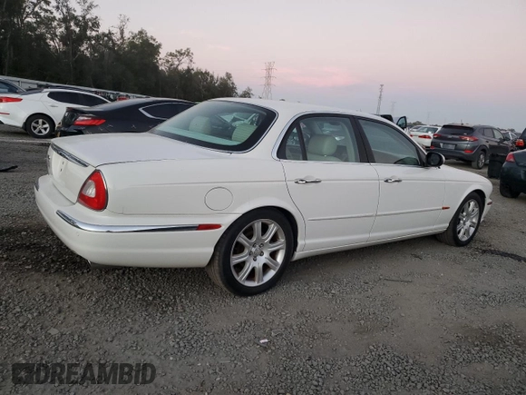 2004 Jaguar XJ with VIN SAJWA71C14SG16264, listed as a Copart auction lot 83251554 with 267,493 mi miles and Salvage Title. Bid and sale history available at carsss.com. Image 3.