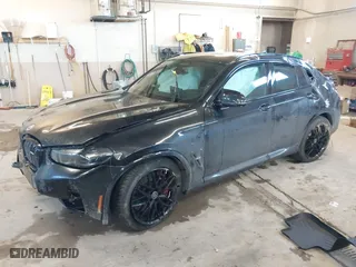 2023 BMW X4 M with VIN 5YM23EC05P9R57259, listed as a IAAI auction lot 41003784 with 33,928 mi miles. Bid and sale history available at carsss.com. Image 2.
