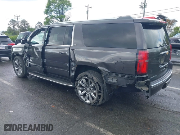 2015 Chevrolet Suburban LTZ with VIN 1GNSKKKC4FR589913, listed as a IAAI auction lot 42017190 with 216,145 mi miles. Bid and sale history available at carsss.com. Image 3.