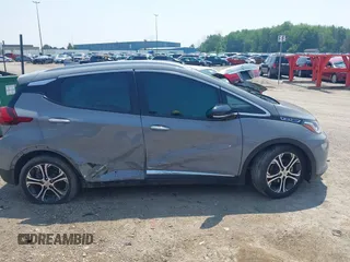2021 Chevrolet Bolt EV Premier z VIN 1G1FZ6S01M4106836, wystawiony jako IAAI lot #42438764 z przebiegiem 27 894 mil mil oraz . Historia ofert i sprzedaży dostępna na DreamBid. Obrazek 13.