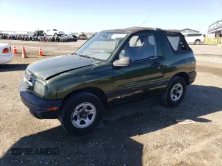 1999 Chevrolet Tracker z VIN 2CNBE1864X6933938, wystawiony jako Copart lot #78889104 z przebiegiem 241 847 mil mil oraz Czysty tytuł • Clean title. Historia ofert i sprzedaży dostępna na DreamBid. Obrazek 1.