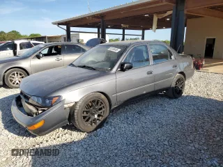 1994 Toyota Corolla with VIN 1NXAE04B4RZ192221, listed as a Copart auction lot 52350455 with 102,032 mi miles and Salvage title. Bid and sale history available at DreamBid. Image 1.