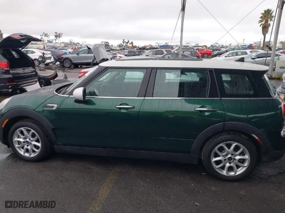 2016 MINI Cooper Clubman with VIN WMWLN5C55G2E07099, listed as a IAAI auction lot 41507429 with 53,271 mi miles. Bid and sale history available at carsss.com. Image 14.