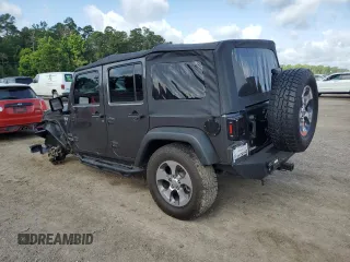 2017 Jeep Wrangler Unlimited Sport with VIN 1C4BJWDG8HL680627, listed as a Copart auction lot 61241735 with 100,890 mi miles and Salvage title. Bid and sale history available at DreamBid. Image 2.