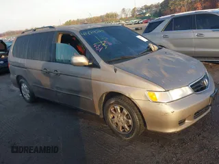 2003 Honda Odyssey EX-L z VIN 2HKRL18933H504797, wystawiony jako IAAI lot #41479289 z przebiegiem 209 672 mil mil oraz . Historia ofert i sprzedaży dostępna na DreamBid. Obrazek 1.