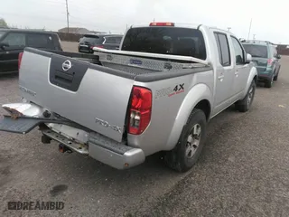 2011 Nissan Frontier PRO-4X with VIN 1N6AD0EV2BC438370, listed as a IAAI auction lot 41952484 with 217,529 mi miles. Bid and sale history available at carsss.com. Image 4.