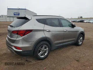 2017 Hyundai Santa Fe 2.4L z VIN 5NMZUDLB7HH030253, wystawiony jako Copart lot #51302445 z przebiegiem 136 074 mil mil oraz Szkoda całkowita • Salvage title. Historia ofert i sprzedaży dostępna na DreamBid. Obrazek 3.