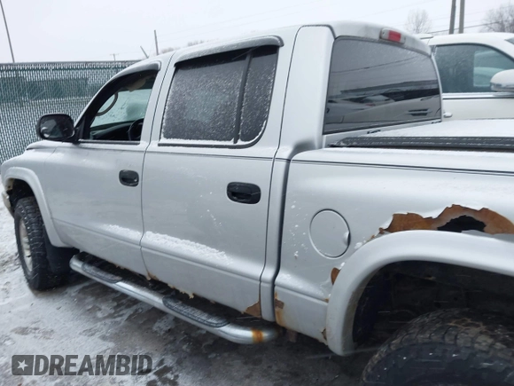 2004 Dodge Dakota SLT with VIN 1D7HG48N34S665027, listed as a IAAI auction lot 41395509 with 128,064 mi miles. Bid and sale history available at carsss.com. Image 14.