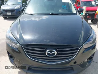 2016 Mazda CX-5 Grand Touring z VIN JM3KE2DY2G0765444, wystawiony jako IAAI lot #42527577 z przebiegiem 162 871 mil mil oraz . Historia ofert i sprzedaży dostępna na DreamBid. Obrazek 6.