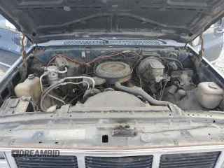 1988 GMC Suburban z VIN 1GKER16K5JF536794, wystawiony jako Copart lot #49308115 z przebiegiem 95 416 mil mil oraz Tytuł czysty. Historia ofert i sprzedaży dostępna na DreamBid. Obrazek 12.