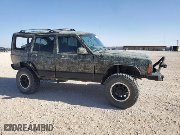 1999 Jeep Cherokee Sport with VIN 1J4FF68S6XL645028, listed as a Copart auction lot 48897255 with 218,552 mi miles and Salvage Title. Bid and sale history available at carsss.com. Image 4.