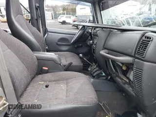 2001 Jeep Wrangler Sport with VIN 1J4FA49S41P355646, listed as a IAAI auction lot 41937746 with 160,634 mi miles. Bid and sale history available at carsss.com. Image 5.