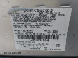 2013 Ford Taurus SEL with VIN 1FAHP2E8XDG164903, listed as a IAAI auction lot 41580690 with 163,128 mi miles and . Bid and sale history available at carsss.com. Image 9.