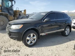 2012 Volkswagen Touareg Lux with VIN WVGEK9BP4CD007069, listed as a Copart auction lot 52427165 with 89,863 mi miles and Salvage title. Bid and sale history available at DreamBid. Image 1.
