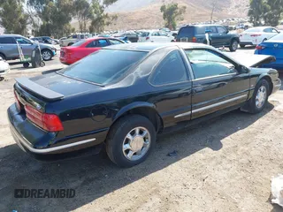 1997 Ford Thunderbird LX with VIN 1FALP62W8VH148943, listed as a IAAI auction lot 39864407 with 191,279 mi miles and . Bid and sale history available at DreamBid. Image 4.