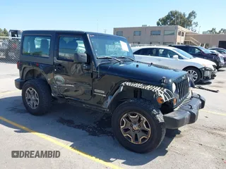 2013 Jeep Wrangler Sport z VIN 1C4AJWAG7DL594283, wystawiony jako IAAI lot #42609762 z przebiegiem 155 291 mil mil oraz . Historia ofert i sprzedaży dostępna na DreamBid. Obrazek 1.