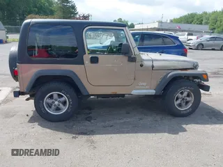 2005 Jeep Wrangler Sport with VIN 1J4FA49SX5P317120, listed as a IAAI auction lot 42677397 with 71,403 mi miles and . Bid and sale history available at DreamBid. Image 13.