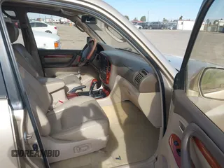 2000 Lexus LX 470 with VIN JT6HT00W0Y0098917, listed as a IAAI auction lot 41937661 with 180,980 mi miles and . Bid and sale history available at DreamBid. Image 5.