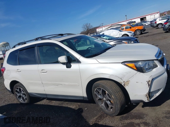 2014 Subaru Forester XT Touring with VIN JF2SJGMC4EH534647, listed as a IAAI auction lot 41828950 with 106,375 mi miles and . Bid and sale history available at DreamBid. Image 13.