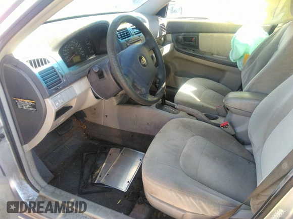 2005 Kia Spectra LX with VIN KNAFE121055121500, listed as a IAAI auction lot 39677018 with 142,307 mi miles. Bid and sale history available at carsss.com. Image 5.