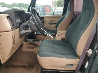 2002 Jeep Wrangler Sahara with VIN 1J4FA59S52P763290, listed as a Copart auction lot 59115665 with 129,479 mi miles and Non repairable. Bid and sale history available at DreamBid. Image 7.