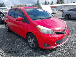 2014 Toyota Yaris L with VIN JTDKTUD36ED574632, listed as a IAAI auction lot 41993369 with 257,342 mi miles. Bid and sale history available at carsss.com. Image 1.