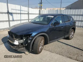2021 Mazda CX-5 Grand Touring with VIN JM3KFADM7M0385788, listed as a Copart auction lot 88065255 with 27,787 mi miles and Salvage Title. Bid and sale history available at carsss.com. Image 1.