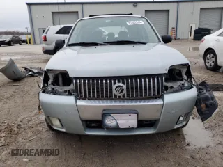 2005 Mercury Mariner Luxury z VIN 4M2CU57105DJ33266, wystawiony jako Copart lot #87002044 z przebiegiem 164 313 mil mil oraz Szkody całkowita. Historia ofert i sprzedaży dostępna na DreamBid. Obrazek 5.
