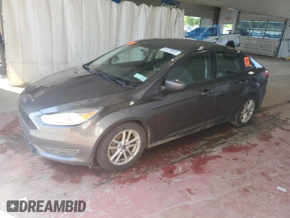 2018 Ford Focus SE z VIN 1FADP3F25JL257815, wystawiony jako Copart lot #61978045 z przebiegiem 62 328 mil mil oraz Szkoda całkowita • Salvage title. Historia ofert i sprzedaży dostępna na DreamBid. Obrazek 1.