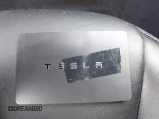 2020 Tesla Model 3 Long Range with VIN 5YJ3E1EB9LF795246, listed as a IAAI auction lot 41895750 with 163,061 mi miles and . Bid and sale history available at DreamBid. Image 11.