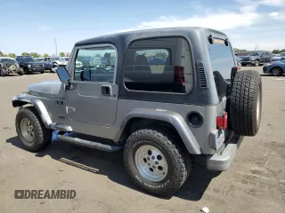 2002 Jeep Wrangler X with VIN 1J4FA39S32P708163, listed as a Copart auction lot 69703254 with 119,843 mi miles and Salvage Title. Bid and sale history available at carsss.com. Image 2.