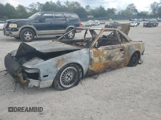 1986 Toyota MR2 z VIN JT2AW15CXG0066425, wystawiony jako Copart lot #74560234 z przebiegiem Nie podano mil oraz Nie do naprawy. Historia ofert i sprzedaży dostępna na DreamBid. Obrazek 1.