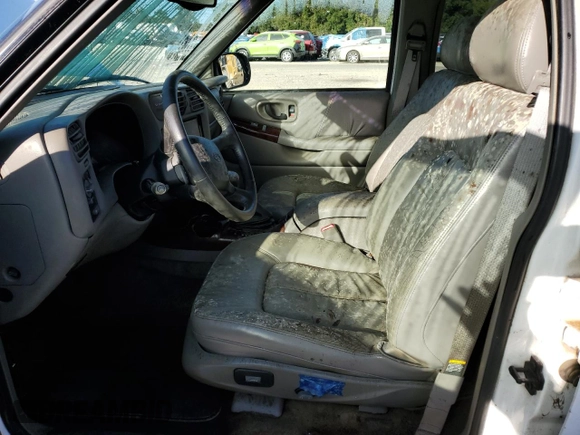 1999 Oldsmobile Bravada z VIN 1GHDT13W1X2704151, wystawiony jako Copart lot #76802764 z przebiegiem 155 630 mil mil oraz Szkoda całkowita • Salvage title. Historia ofert i sprzedaży dostępna na DreamBid. Obrazek 7.