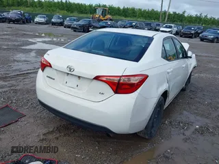 2018 Toyota Corolla L with VIN 2T1BURHE4JC089743, listed as a IAAI auction lot 42507107 with 140,742 mi miles and . Bid and sale history available at DreamBid. Image 4.