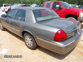 2003 Mercury Grand Marquis LS Premium z VIN 2MEHM75WX3X704496, wystawiony jako IAAI lot #42257767 z przebiegiem 200 885 mil mil oraz . Historia ofert i sprzedaży dostępna na DreamBid. Obrazek 3.
