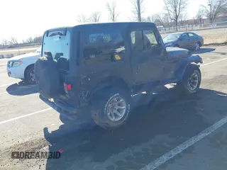 1997 Jeep Wrangler SE with VIN 1J4FY29P6VP438125, listed as a IAAI auction lot 41770455 with 163,001 mi miles. Bid and sale history available at carsss.com. Image 4.