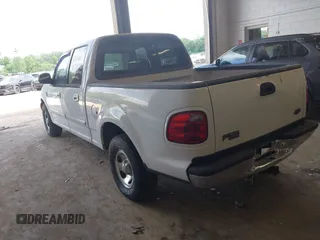 2001 Ford F-150 XLT with VIN 1FTRW07LX1KD77186, listed as a IAAI auction lot 42564774 with 190,647 mi miles and . Bid and sale history available at DreamBid. Image 3.