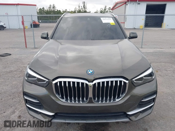 2022 BMW X5 xDrive45e z VIN 5UXTA6C00N9L06383, wystawiony jako IAAI lot #38552162 z przebiegiem 19 592 mil mil oraz . Historia ofert i sprzedaży dostępna na DreamBid. Obrazek 12.