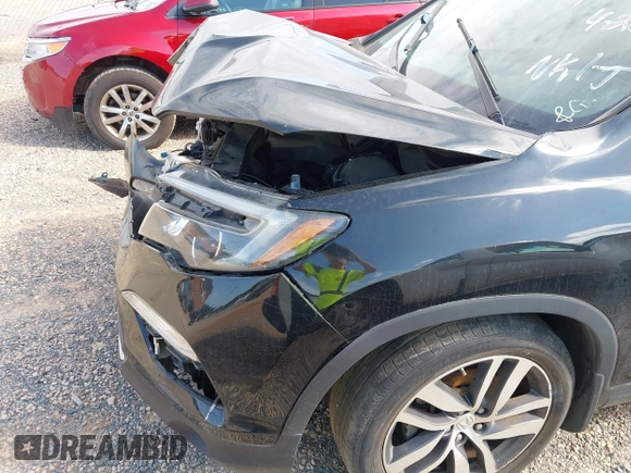 2017 Honda Pilot Touring with VIN 5FNYF5H91HB038268, listed as a IAAI auction lot 42786448 with 62,195 mi miles and . Bid and sale history available at DreamBid. Image 22.
