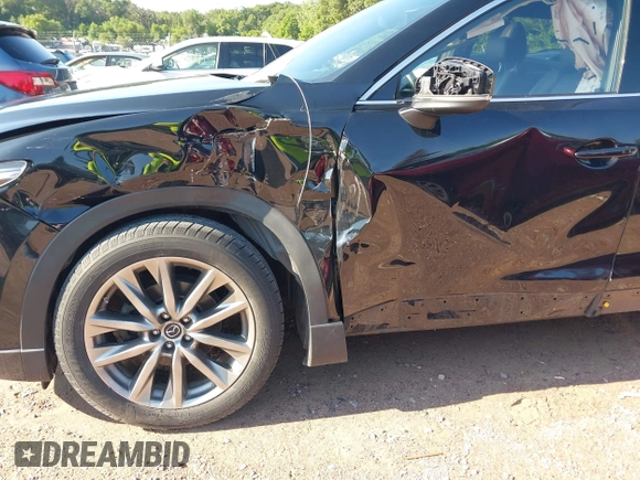 2018 Mazda CX-9 Grand Touring with VIN JM3TCBDYXJ0208962, listed as a IAAI auction lot 42629720 with 123,929 mi miles and . Bid and sale history available at DreamBid. Image 6.
