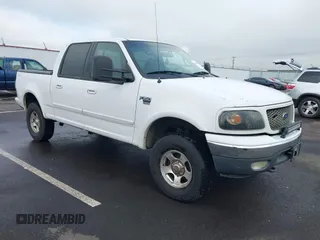 2001 Ford F-150 SuperCrew XLT with VIN 1FTRW08W11KD99683, listed as a IAAI auction lot 41329500 with 218,080 mi miles. Bid and sale history available at carsss.com. Image 1.
