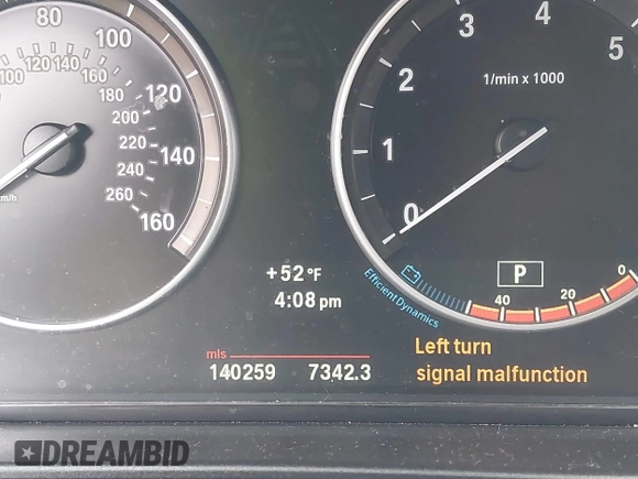 2013 BMW 5 Series 528i xDrive with VIN WBAXH5C5XDD106981, listed as a IAAI auction lot 42012477 with 140,259 mi miles. Bid and sale history available at carsss.com. Image 7.