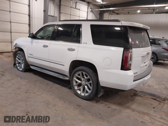 2015 GMC Yukon SLE with VIN 1GKS2AKC6FR103447, listed as a IAAI auction lot 41596220 with 104,209 mi miles. Bid and sale history available at carsss.com. Image 3.