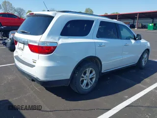 2013 Dodge Durango Crew with VIN 1C4RDJDG0DC670810, listed as a IAAI auction lot 41974024 with 209,379 mi miles and . Bid and sale history available at DreamBid. Image 4.