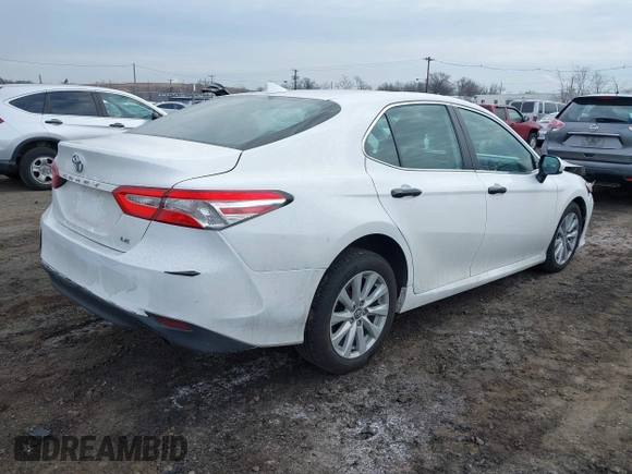 2020 Toyota Camry LE with VIN 4T1C11AK9LU912585, listed as a IAAI auction lot 41711816 with 142,751 mi miles. Bid and sale history available at carsss.com. Image 4.